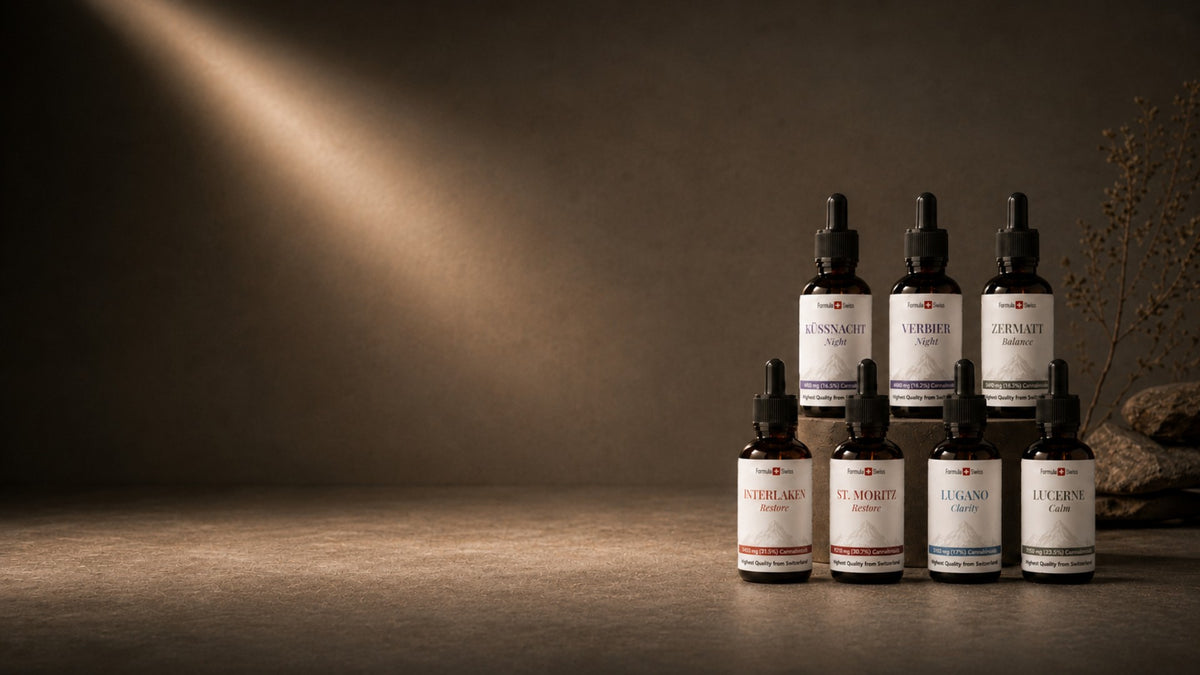 Formula Swiss CBD oil collection featuring seven amber dropper bottles arranged in a premium studio setting.